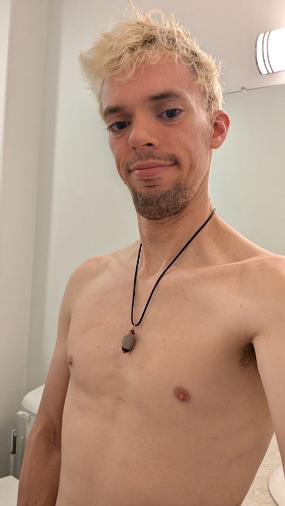 Direct angle of me shirtless and nude wearing my Shiva stone.