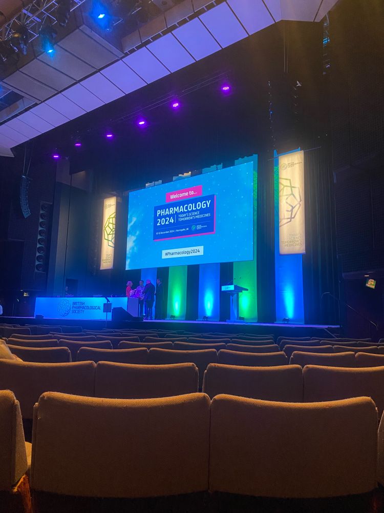Auditorium with ‘welcome to pharmacology 2024’ slide displayed