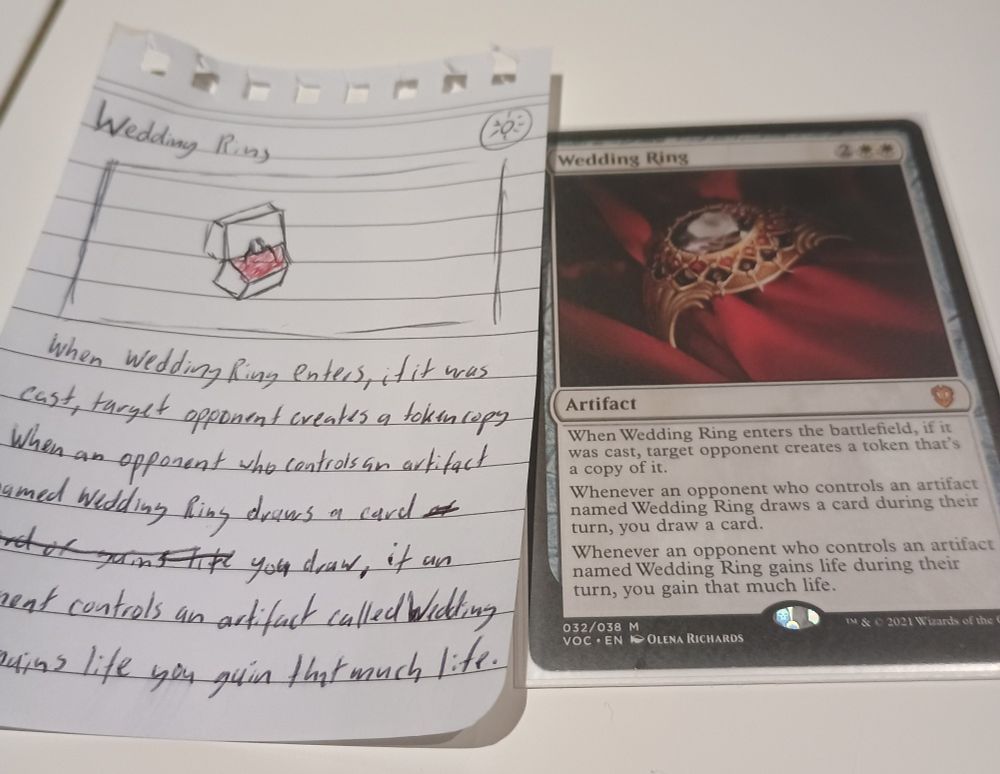 A copy of the Magic the Gathering card "Wedding Ring" and a crudely draw ln copy of it.