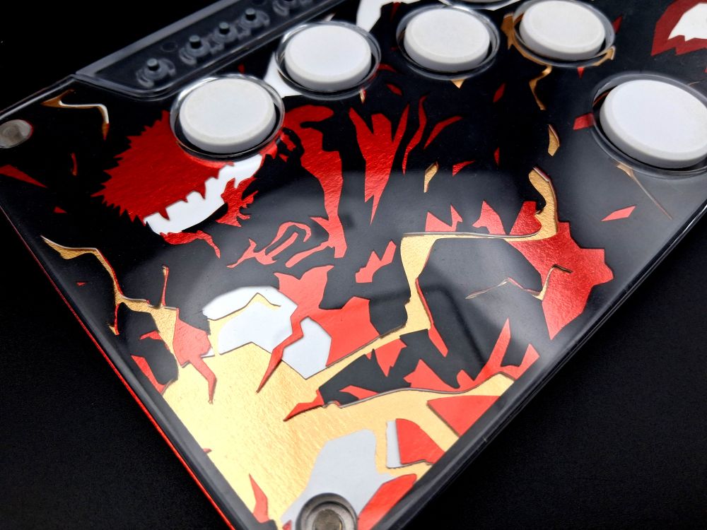 A bold black leverless fightstick with the character RYU on it with his name in bright red letters on the right