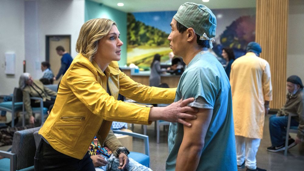 Rhea Seehorn grabbing a doctor in “Pluribus”