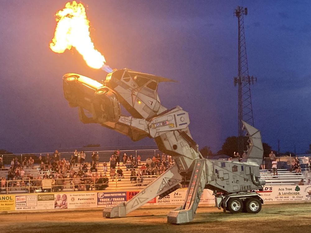 its robosaurus, a friday night race track spectacle that can grab and lift cars, then burninate them with nostril flame throwers. it has two arms, two legs (with hidden wheels), and a rotating semi-truck wheel base it uses to steer. the whole aesthetic is robotic/scifiship