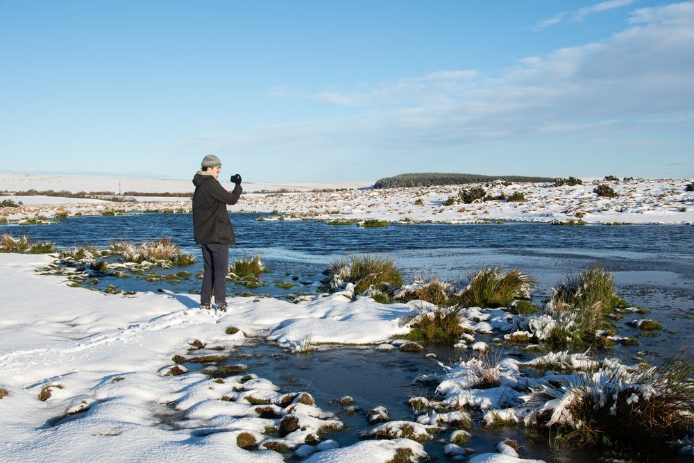 I'm attempting to take a picture of a lake with my terrible phone on a very chilly looking Bodmin moor