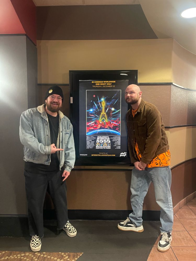 Local dweebs pose with old movie poster 