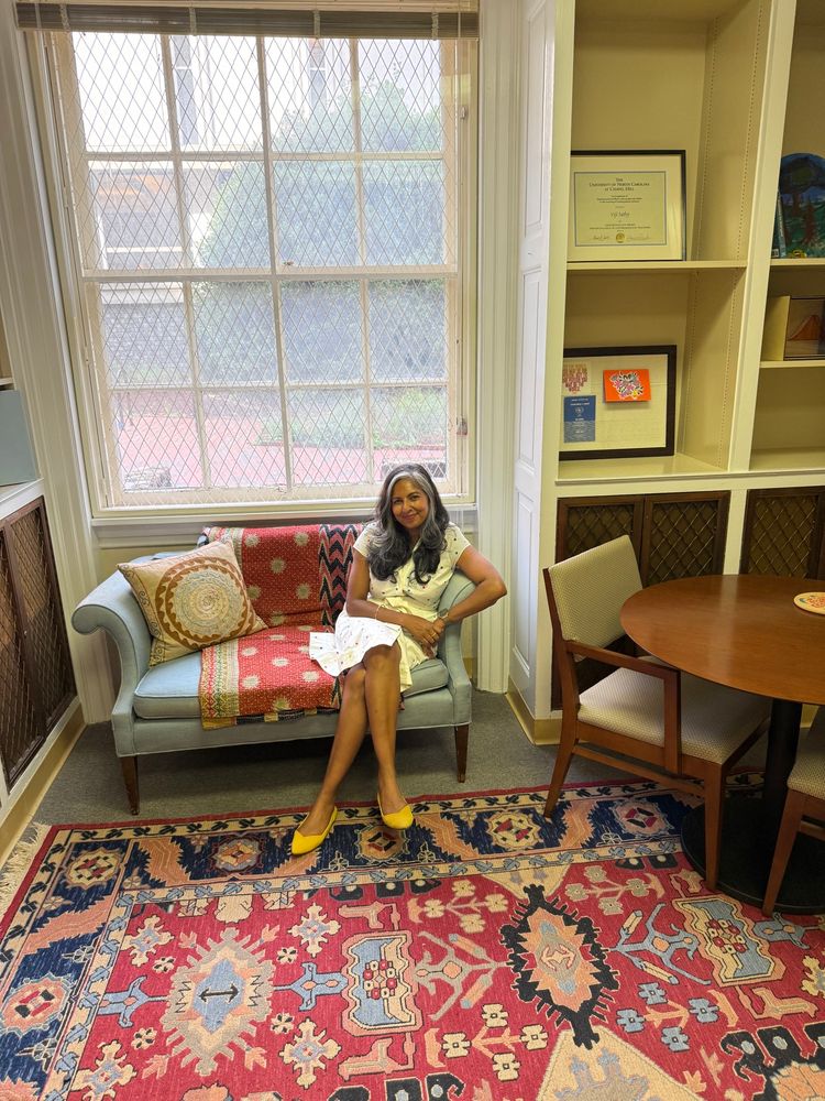 Photo of me on a sofa in my office