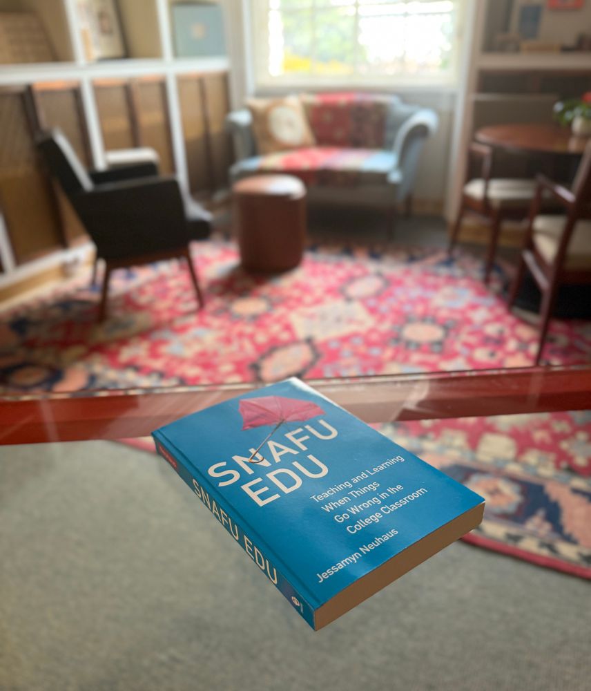 Copy of snafu edu on my red metal desk in my office