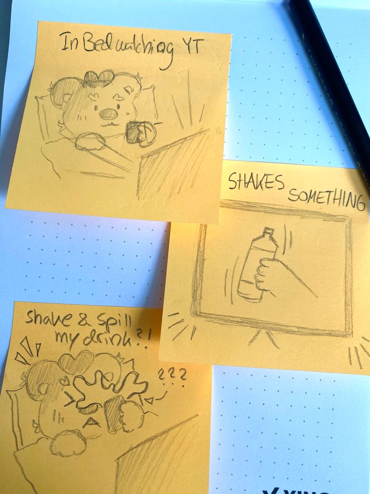 A photo of three post it’s put together as a short comic telling the story of a bear sitting in bed, watching something being shook on TV and for some reason also shaking their drink spilling it everywhere.