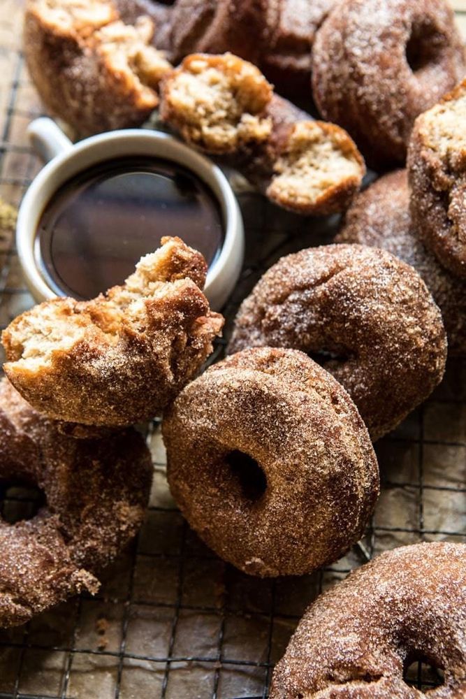 Cup of coffee and cinnamon doughnuts. 