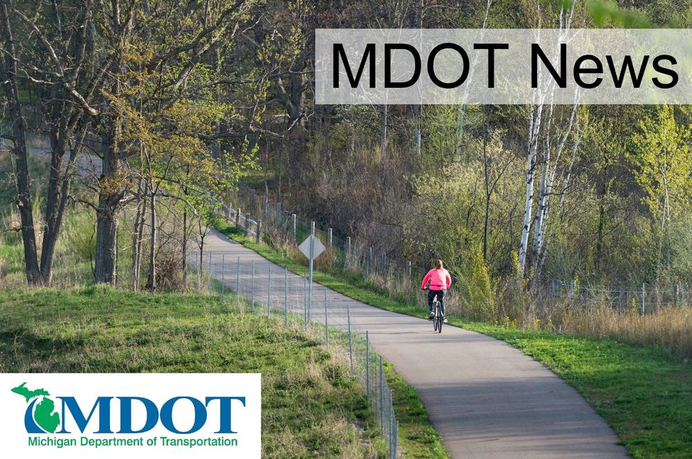Bicyclist rides along a trail.