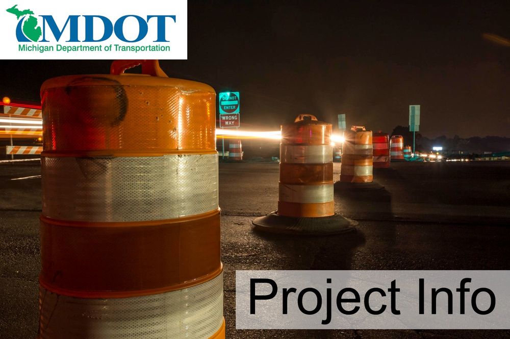 Orange barrels at night.