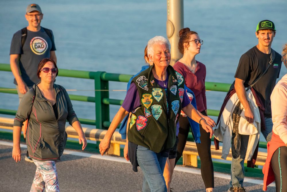 People walking on a bridge.