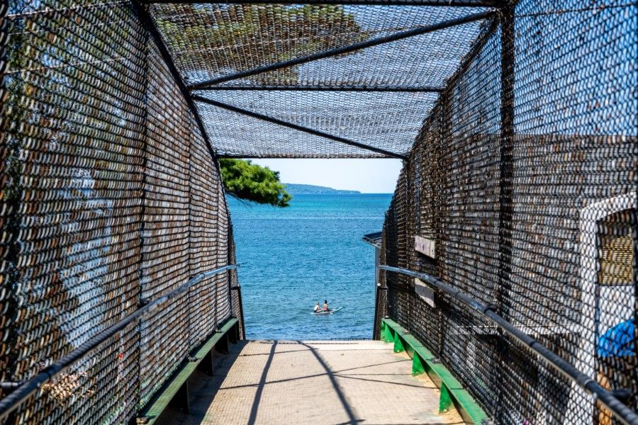 Looking through a bridge access to a lake.
