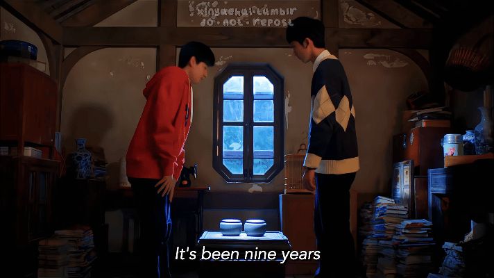 Shi Guang and Yu Liang sitting down to play go, with the subs saying "It's been nine years."