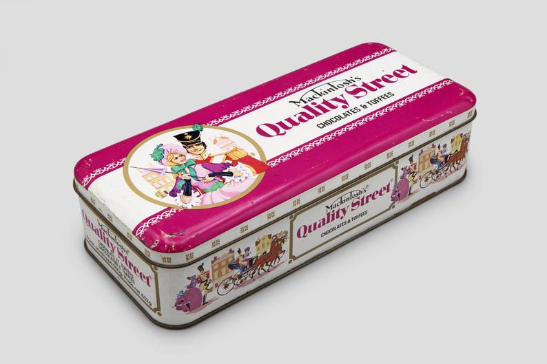 A classic Quality Street tin, shaped like a loaf.