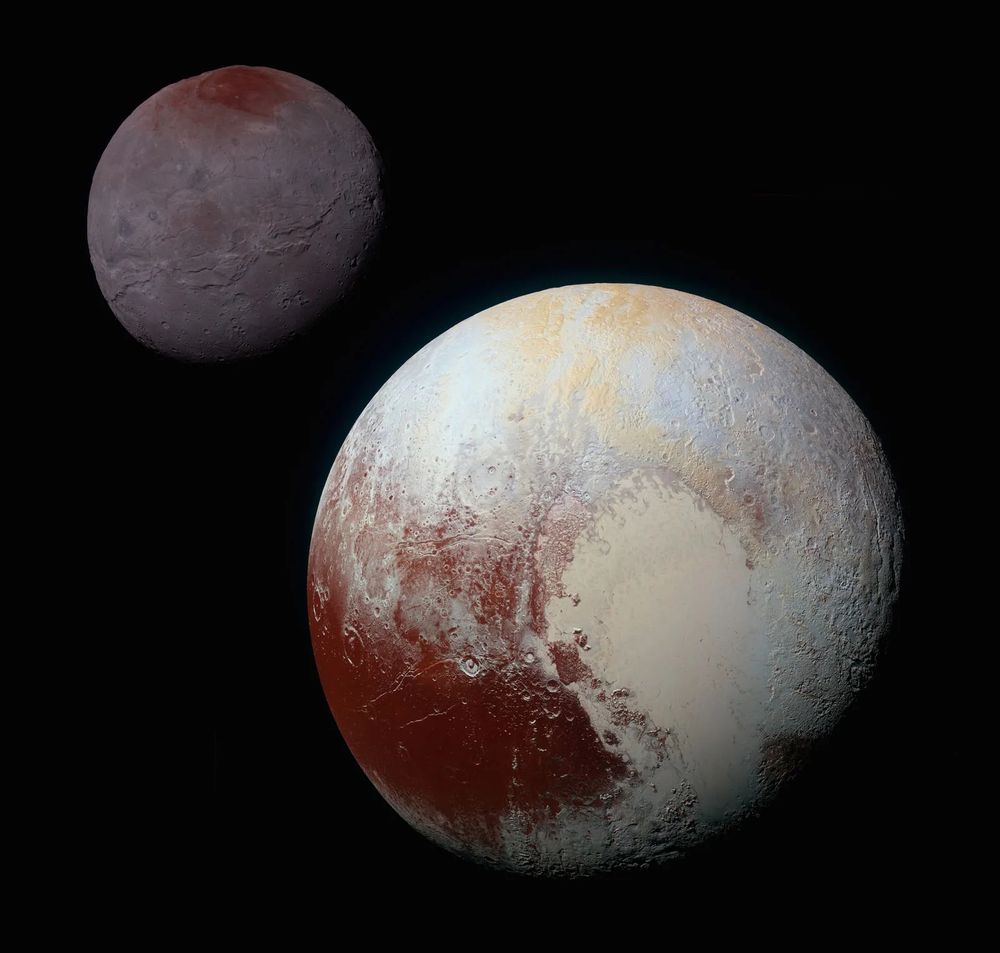 Pluto and Charon – A Binary System Revealed

This vivid color-enhanced image captures Pluto and its largest moon, Charon, in unprecedented detail, revealing not only their striking surface differences but also their unique gravitational relationship. Captured by NASA’s New Horizons spacecraft during its historic flyby in July 2015, the image illustrates one of the most unusual pairings in the solar system. Pluto, the larger body in the foreground, displays a diverse and dynamic surface with deep red and orange hues, likely caused by tholins—complex organic molecules formed when solar radiation interacts with methane and nitrogen in Pluto’s atmosphere. A massive heart-shaped plain known as Sputnik Planitia dominates its face, hinting at active geology, possible subsurface oceans, and atmospheric processes.

In contrast, Charon appears in the background with a muted, greyish tone, marked by dark patches near its poles and a network of ridges, fractures, and impact craters. Despite its smaller size—roughly half Pluto’s diameter—Charon’s mass is significant enough that the center of gravity between the two bodies, or barycenter, lies outside of Pluto itself. This makes Pluto-Charon a binary system rather than a traditional planet-moon configuration, a distinction that played a role in debates about Pluto’s planetary status and its eventual reclassification as a dwarf planet in 2006.

The two bodies are tidally locked, meaning the same sides always face each other, adding to their mystique. This image helped scientists understand more about planetary formation, surface evolution, and the complex interplay between celestial bodies in the distant Kuiper Belt. It also symbolized a triumph of long-range exploration, as New Horizons revealed not only what Pluto and Charon look like, but also how rich and surprising the outer solar system can be—redefining our concept of what constitutes a planetary system.