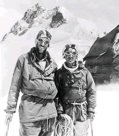 Triumph at the Roof of the World – Hillary and Norgay on Everest (1953)

This iconic photograph captures Sir Edmund Hillary of New Zealand and Tenzing Norgay, a Sherpa of Nepalese and Tibetan heritage, standing triumphantly on the slopes of Mount Everest in the days surrounding their historic ascent on May 29, 1953. Dressed in heavy expedition gear—bulky jackets, protective snow goggles, and ropes coiled at their waists—the duo exudes the physical exhaustion and immense pride that followed their unparalleled achievement. Behind them, the craggy, wind-swept Himalayan peaks loom with an almost spiritual intensity, emphasizing the magnitude of what they had just conquered. Their success marked the first confirmed summit of the world’s highest mountain, a feat long considered the ultimate challenge in mountaineering.

The photograph is a testament not only to their courage and endurance but also to the culmination of years of evolving mountaineering technology. Lightweight but thermally resilient gear, custom oxygen systems, and advancements in high-altitude medicine made this mission possible—tools unavailable to early 20th-century Everest expeditions. Perhaps even more vital was the partnership itself: Hillary, a trained beekeeper turned climber, and Norgay, whose intimate knowledge of the Himalayas and unmatched strength at high altitude had made him essential on previous missions. Their collaboration symbolized the unification of Western exploration and indigenous expertise at a time when such recognition was rare. This image remains one of the most enduring representations of human tenacity, scientific progress, and cross-cultural unity in the face of nature’s most unforgiving extremes.