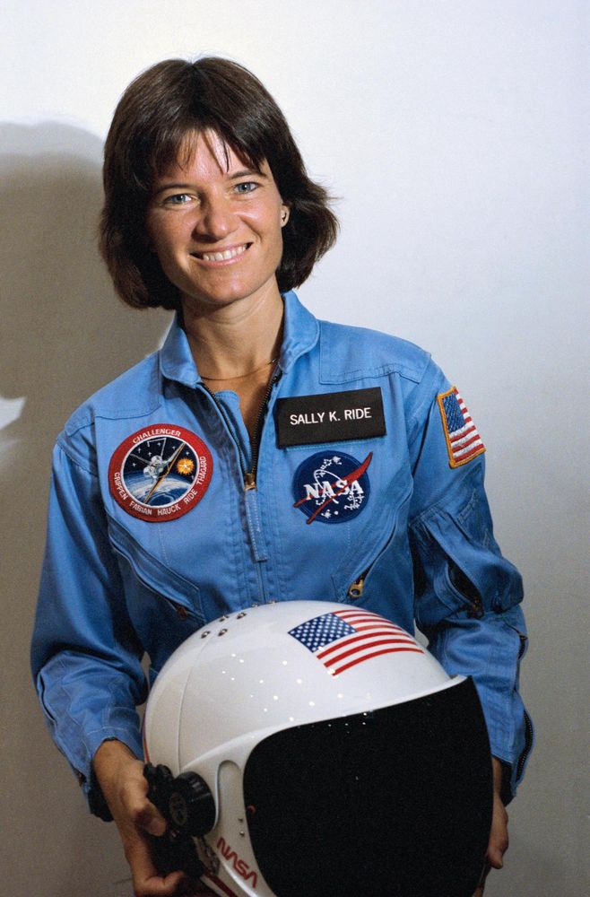 Sally Ride – Breaking Barriers Beyond Earth

This image captures a defining moment in American space history: astronaut Sally Ride, standing proudly in her NASA uniform and holding her white helmet adorned with the U.S. flag. Taken shortly before her pioneering mission aboard the Space Shuttle Challenger on June 18, 1983, the photo immortalizes Ride as the first American woman in space. Her uniform, with the STS-7 mission patch prominently displayed, symbolizes a milestone not just in NASA’s legacy but in the broader arc of gender equality in science and engineering. Her confident smile reflects the spirit of a trailblazer stepping into the unknown, representing not only her crew but the aspirations of countless women and girls previously excluded from the space race narrative.

Ride’s mission aboard Challenger lasted six days, during which she helped deploy communications satellites and conducted science experiments using the shuttle’s robotic arm. But her impact extended far beyond the mission’s technical successes. At a time when aerospace was dominated by men, her selection and flight proved that women could perform equally in the rigors of spaceflight—shattering lingering stereotypes within the military-industrial complex, academia, and public imagination.

In the years that followed, Sally Ride became an outspoken advocate for science education and equality in STEM fields. She founded Sally Ride Science to inspire young students, particularly girls, to pursue careers in science and engineering. This image, often used in classrooms and media retrospectives, continues to resonate as a symbol of courage, excellence, and representation. It is not just a portrait of one astronaut—it is an emblem of a turning point in space history and the ongoing journey toward inclusivity and innovation.