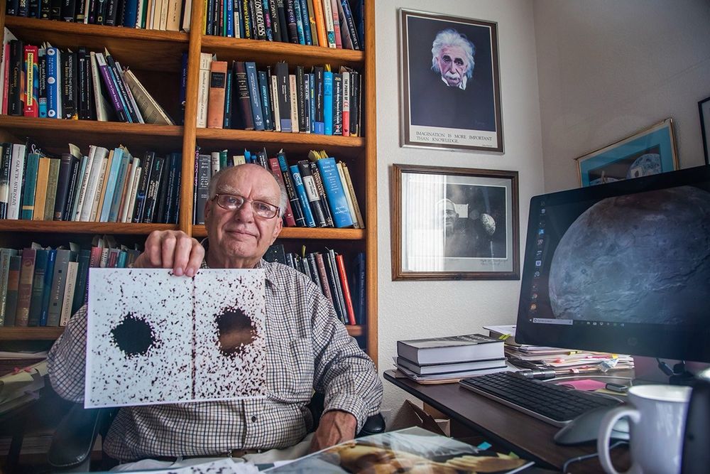 James Christy and the Discovery of Charon – A Breakthrough in Outer Solar System Astronomy

This image captures American astronomer James Christy proudly displaying the photographic plates that led to his 1978 discovery of Charon, Pluto’s largest moon. Seated in his office at the U.S. Naval Observatory in Flagstaff, Arizona, Christy is surrounded by shelves of astronomical texts and scientific journals, a reflection of decades of celestial research. On the wall behind him hangs a portrait of Albert Einstein, symbolic of the scientific legacy Christy contributed to with his revelation. The photograph he holds shows two distinct images of Pluto, one slightly elongated—evidence of an accompanying satellite. This subtle bulge, first dismissed as a photographic artifact, was scrutinized by Christy, who hypothesized that Pluto’s image wobble indicated the gravitational presence of a moon. His insight was confirmed on June 22, 1978, revolutionizing the understanding of Pluto as a binary planetary system.

Charon’s discovery was not only remarkable for its location at the fringes of the solar system but also for what it revealed about planetary classification, orbital dynamics, and moon formation. Christy’s work laid the foundation for subsequent missions, including NASA’s New Horizons flyby in 2015, which captured detailed images of Charon’s surface. The find significantly impacted Pluto’s fate as well; the realization that Pluto and Charon orbit a barycenter outside of Pluto itself played a key role in its 2006 reclassification from a planet to a dwarf planet. This image of Christy bridges the personal and the astronomical—his modest smile underscoring a moment when quiet observation reshaped planetary science. Through one man’s persistence and a few specks on a photographic plate, an entire world came into clearer view.