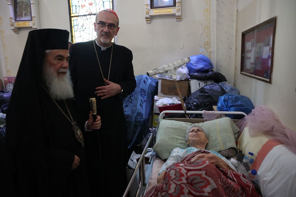 Cardinal Pizzaballa and Patriarch Theophilos III visit an injured person in Gaza