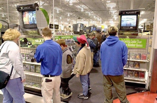 A BestBuy games isle, with Xbox and PS2 kiosks
