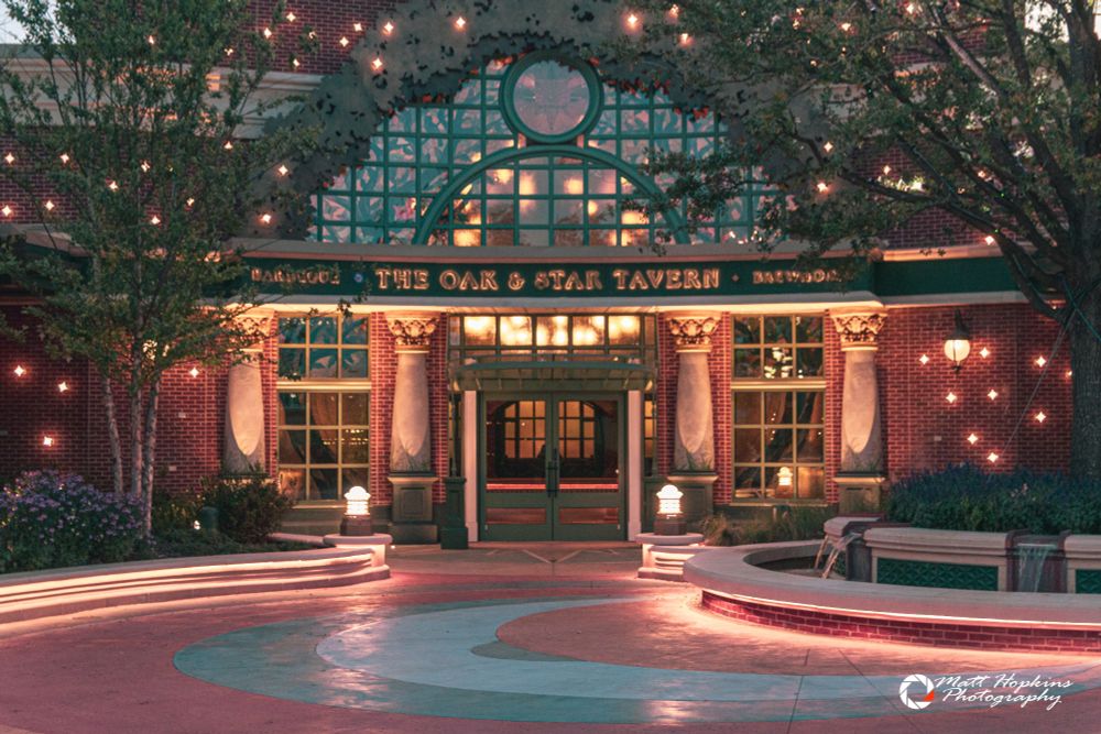 The Oak & Star Tavern lit up at dusk.
