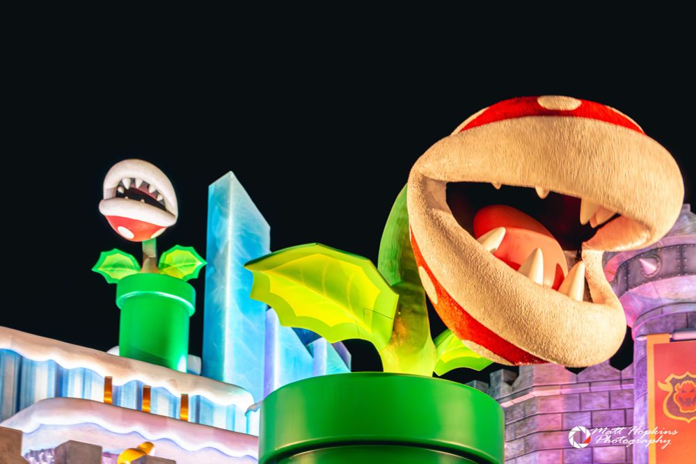 Piranha Plants lit up at night in front of Bowser's Castle
