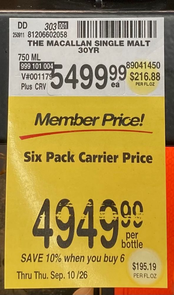 A grocery store shelf tag for bottles of The Macallan 30-year-old single malt Scotch, showing a price of $5499.99 for a 750 ml bottle. But the price per bottle if you are a member and buy six of them is only $4949.99!