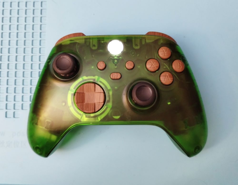 Transparent green xbox controller with fake wood buttons