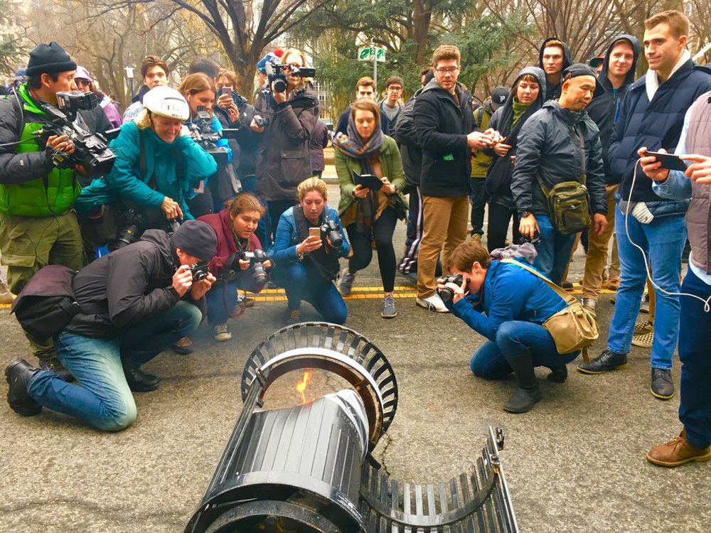 A bunch of asshole photo journalists all crowded around one burning, flipped over and slightly damaged trash can to promote a specific bullshit narrative