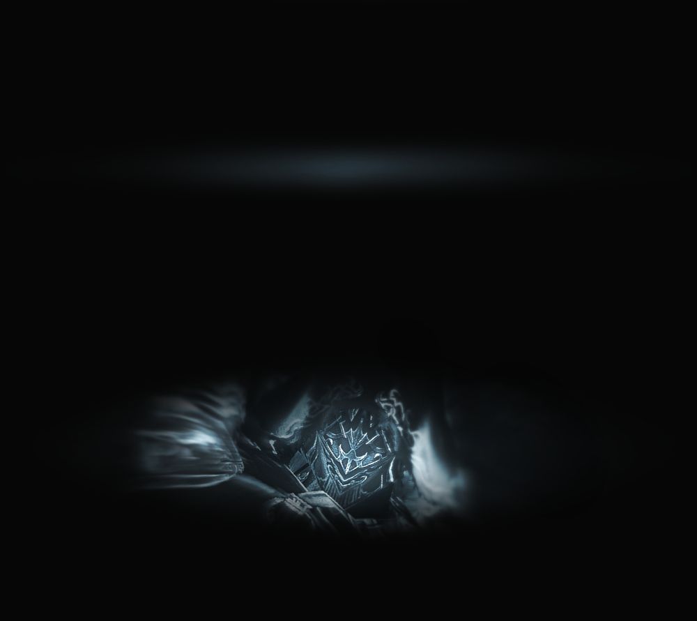 an image made to imitate an eye slowly opening.

first, you see the barely noticeable color of the sky.

what you see next is what you see last: the mask of the figure that stood with its back facing you just moments ago.