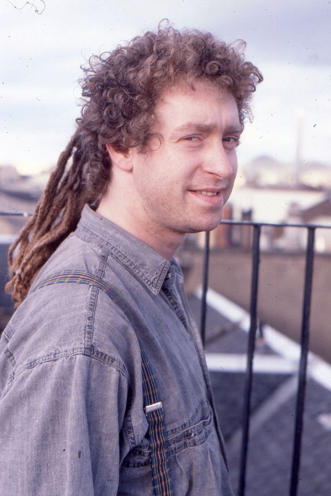 Me aged about 30 on a rooftop terrace with dreadlocks at the back