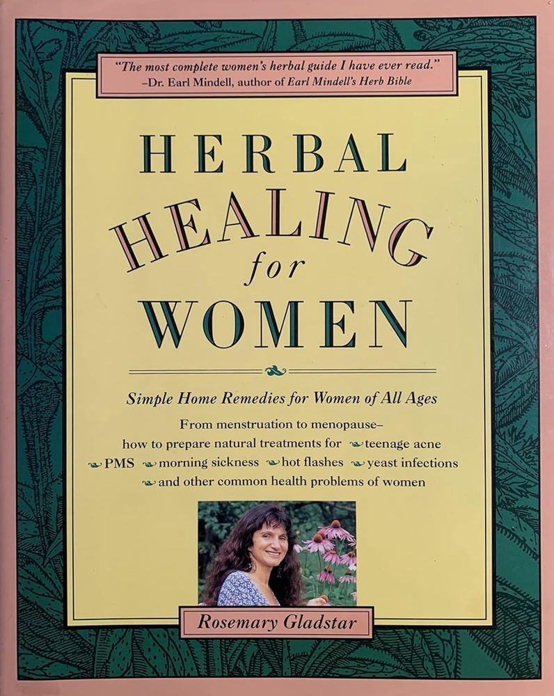 The cover of the book Herbal Healing for Women by Rosemary Gladstar. The cover has a pink border with a green botanical illustration in the background. The title is in large, bold, green and red letters on a yellow background. A quote at the top reads: “The most complete women’s herbal guide I have ever read.”—Dr. Earl Mindell. Below the title, the subtitle states: Simple Home Remedies for Women of All Ages. The text lists topics covered in the book, including menstruation, menopause, teenage acne, PMS, morning sickness, hot flashes, and yeast infections. At the bottom, there is a photograph of Rosemary Gladstar smiling next to an echinacea flower. Her name is displayed in a pink box below the photograph.