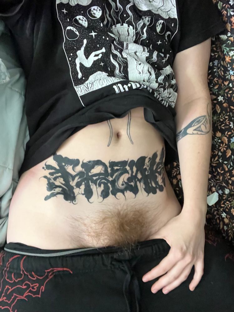 Another photo of Gore on their bed with their bush peaking out. Relaxed cozy photo, perfect for after sex cuddles. 