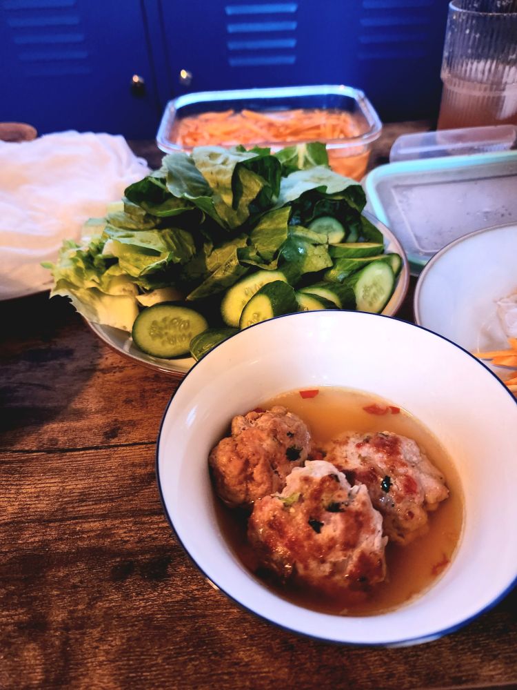 A photo of bun cha on a table.