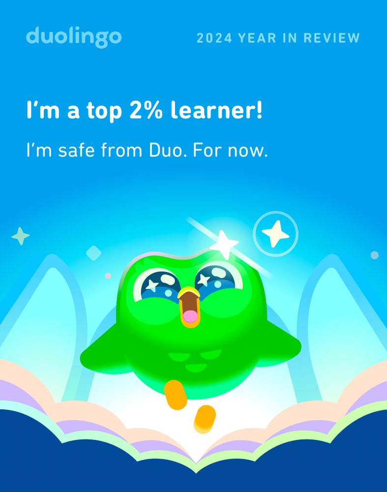 Duolingo year review screenshot, featuring the app‘s green mascot owl Duo and the text „I‘m a top 2% learner! I‘m safe from Duo. For now.“