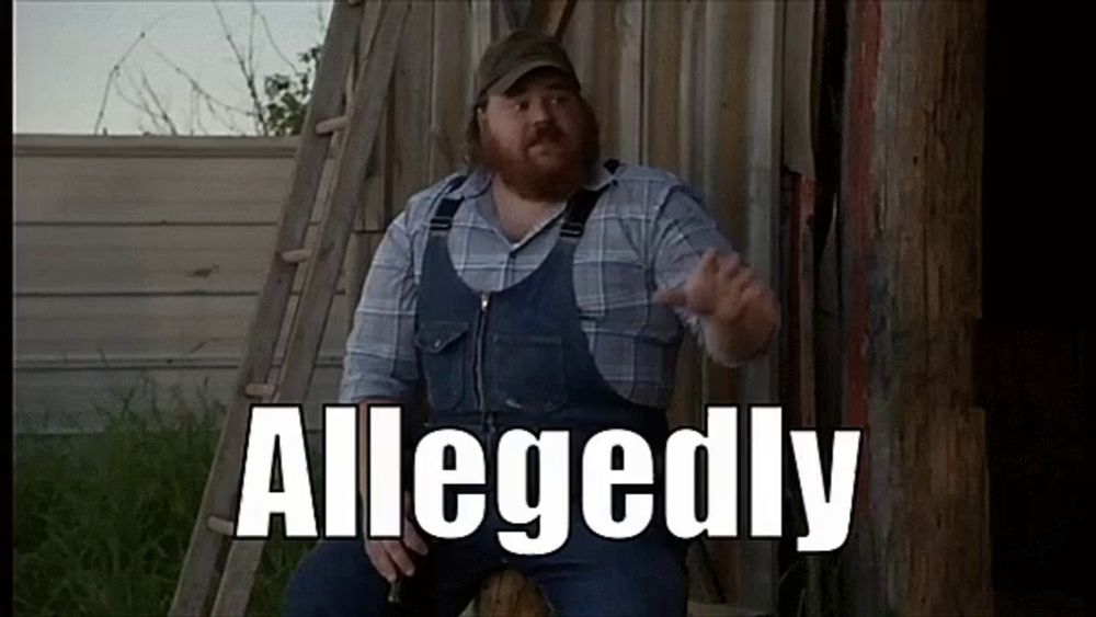 a man in overalls and a plaid shirt is sitting in front of a wooden fence with the word allegedly written on it