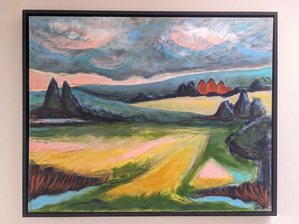 Mixed media, semi-abstract painting in a black frame showing fields, trees, cloudy skies, and a stately home in the distance.