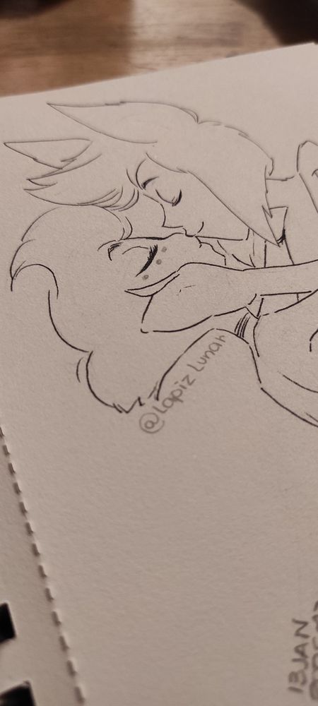 Photo of the same sketch from another angle, Alastor and Angel Dust kissing.

Keywords: Radiodust, sketch, pencil drawing, traditional art.