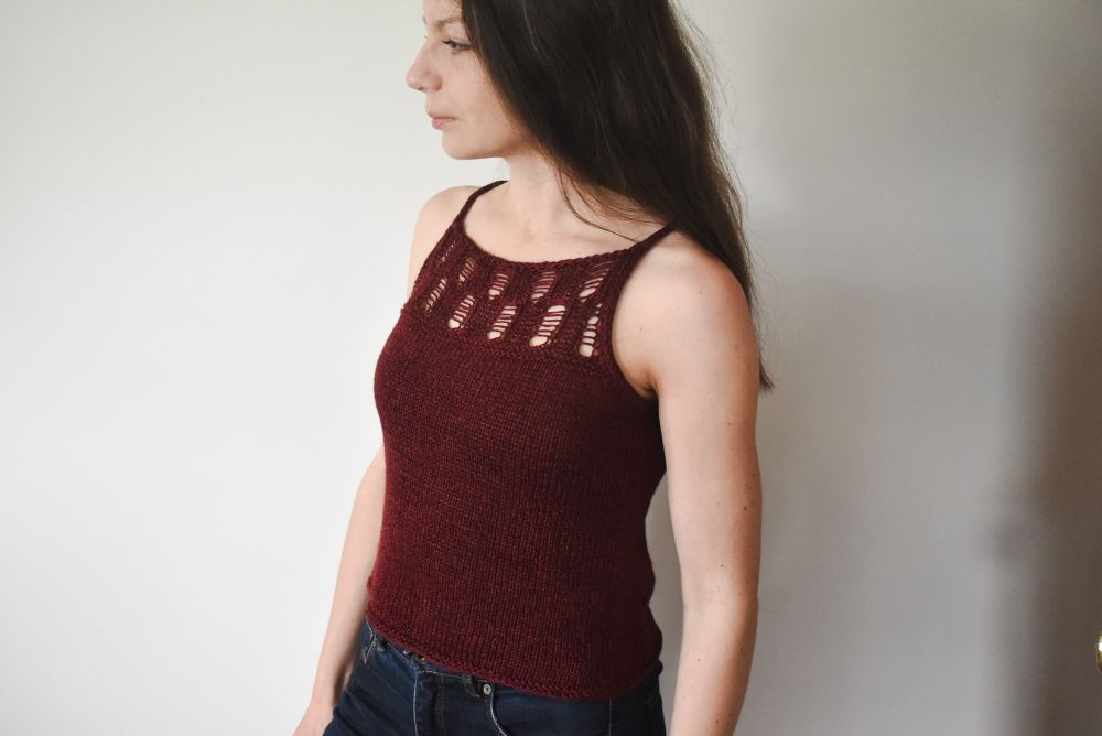 Summer top knitting pattern with a drop stitch pattern below the neck.