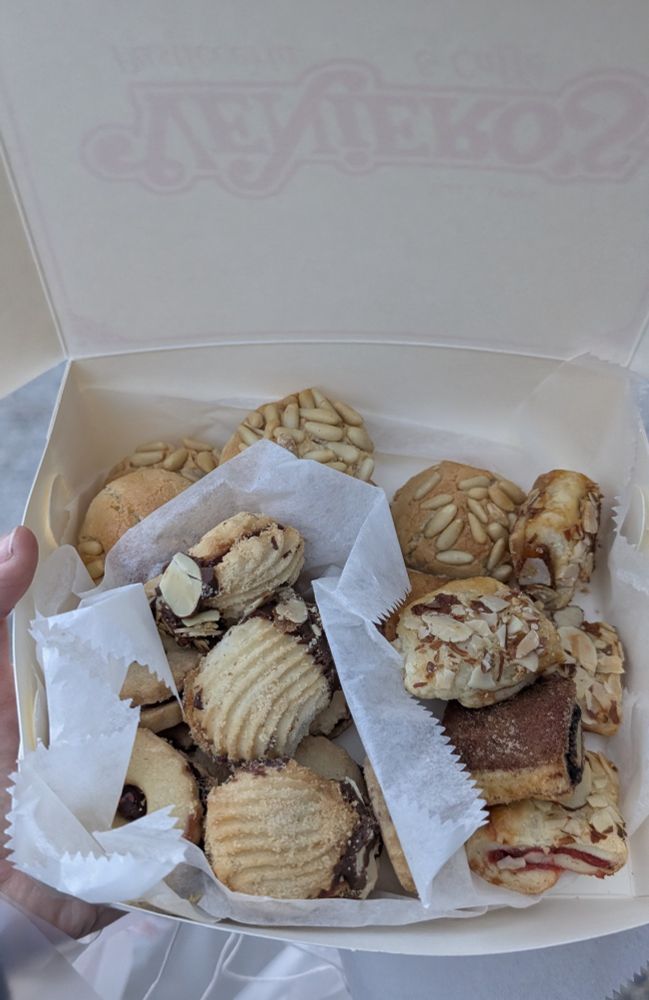 An assortment of short bread cookies, rugelach, and pignoli.