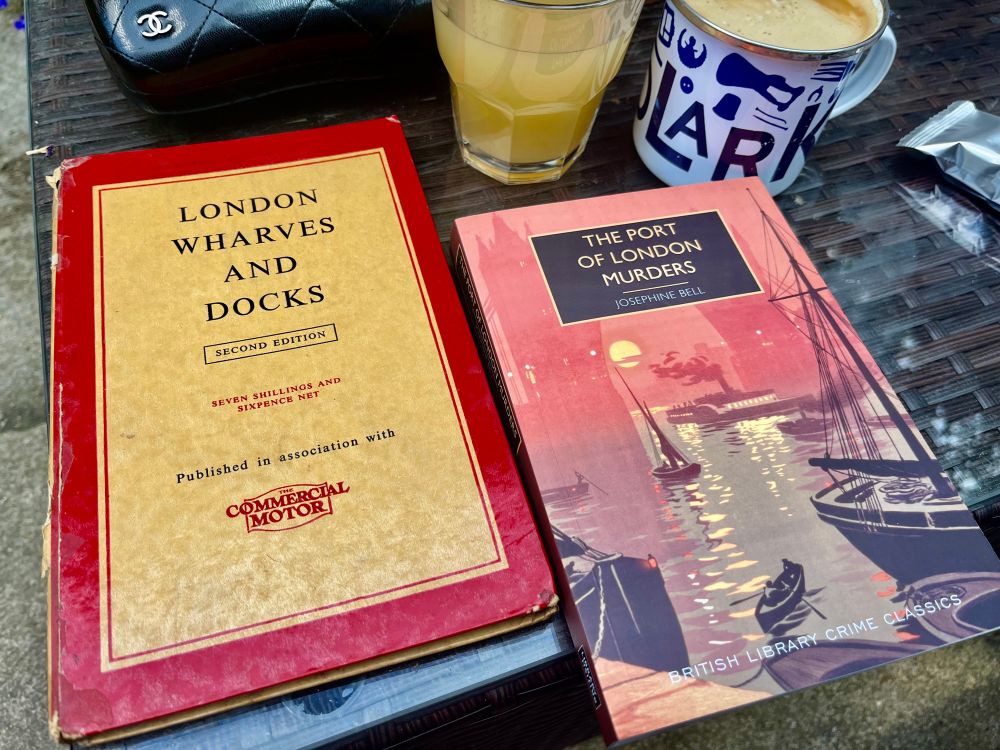 Weekend reading. Photo showing two new books on a garden coffee table - a vintage copy of ‘London Wharves and Docks’ on the left, and ‘The Port of London Murders’ by Josephine Bell.