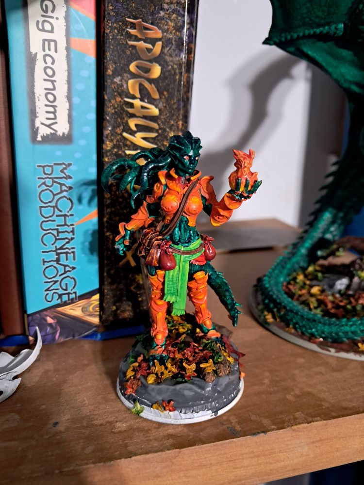 Vineripper in humanoid form, a powerful green dragon. 