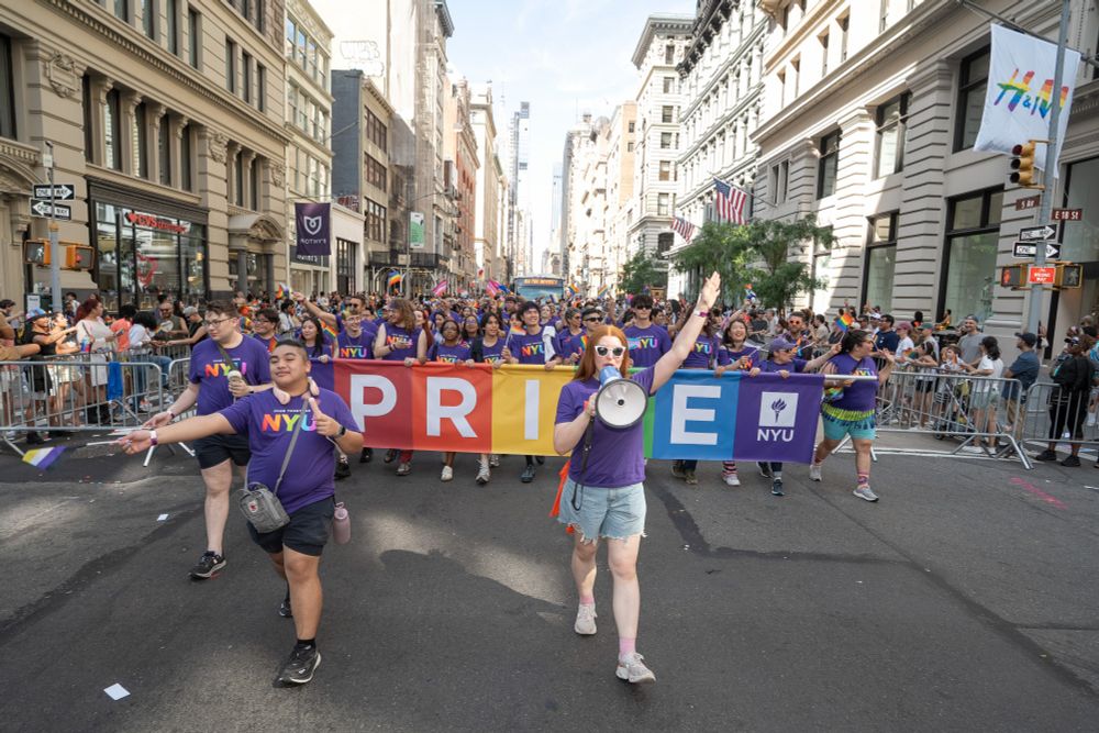 Pride marchers from NYU walk the route with leaders in the front