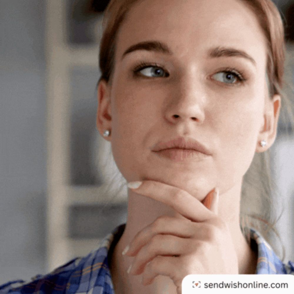 a close up of a woman 's face with a sendwishonline.com logo