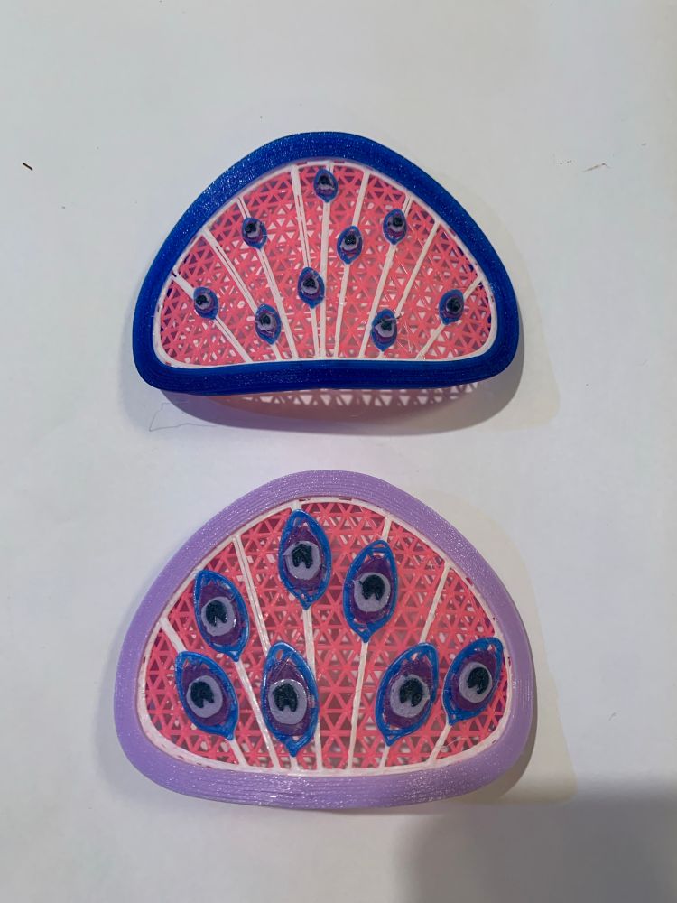 Peacock feather decorations, in purple, pink and blue