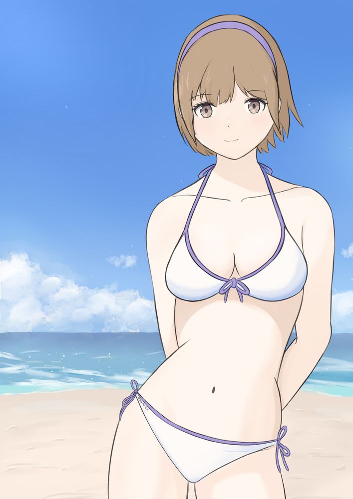 Young woman wearing a bikini style swimsuit on a sunny day at the beach. She’s looking towards the viewer smiling with her arms behind her back and hips to the side. She has short brown hair proofed up in the back by a headband. Her Swimsuit is white with purple accents on the ties matching her headband.