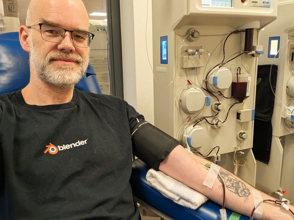Selfie with a needle in my arm and an impressive machine behind me.