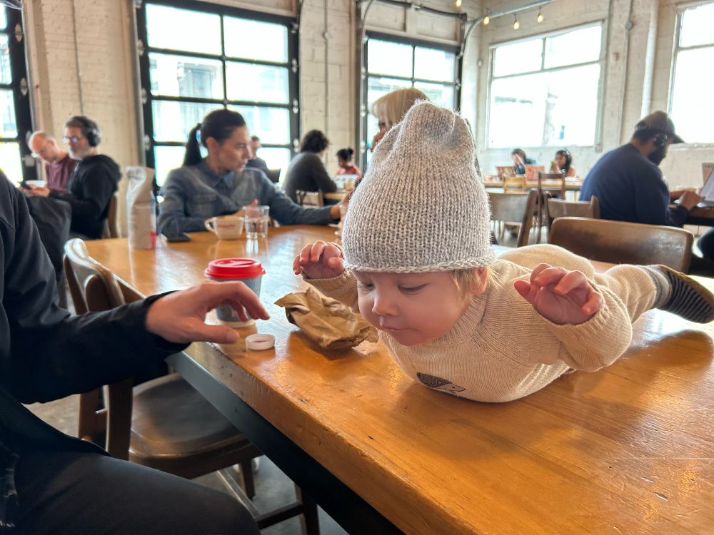 baby on a table at a cafe 