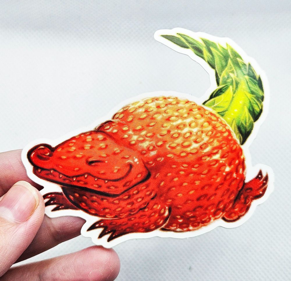 A sticker of a strawberry alligator