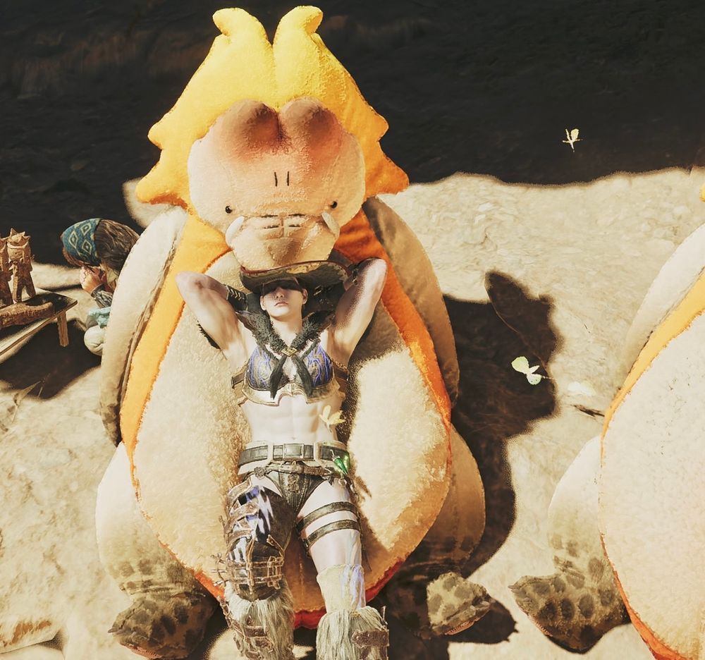 モンスターハンターワイルズのプレイ画面　ビキニ装備で日光浴しているハンター